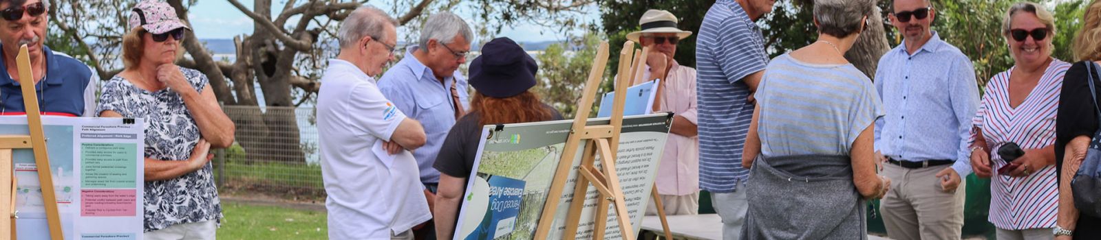 Image of a crowd around artwork in a public space banner image