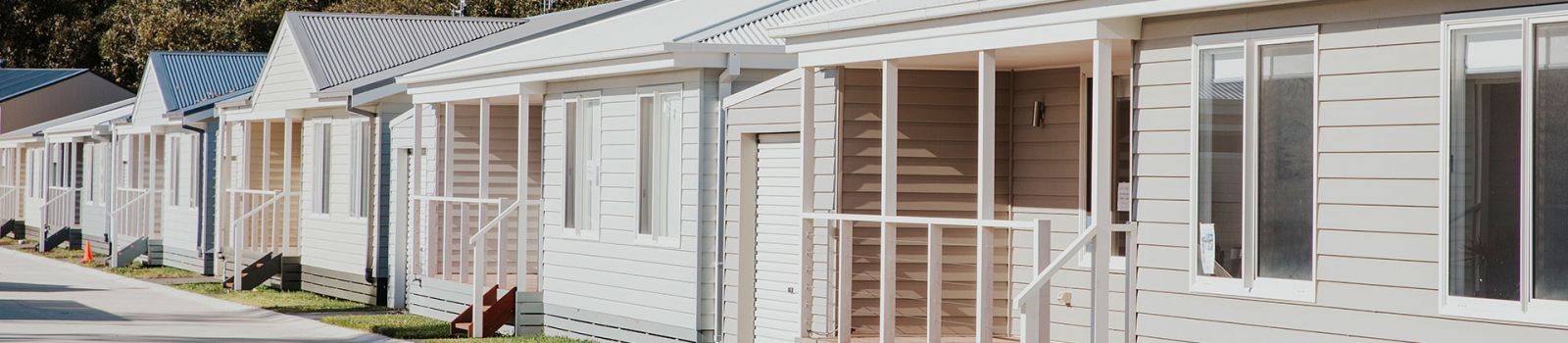 Image of manufactured homes lining a street in One Mile banner image