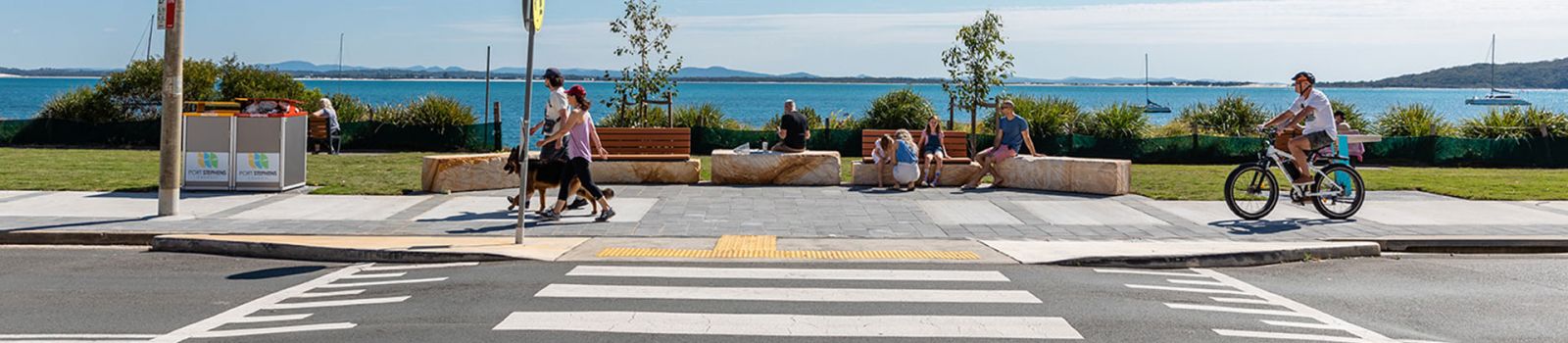 Image of a pedestrian crossing over looking the beach  banner image