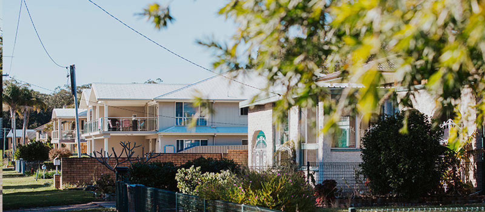 Image of a new house with trees surrounding it banner image