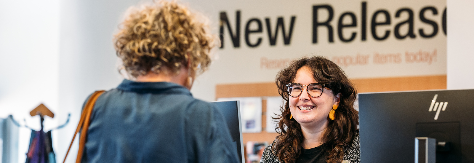 Customer being served at Visitor Information Centre banner image