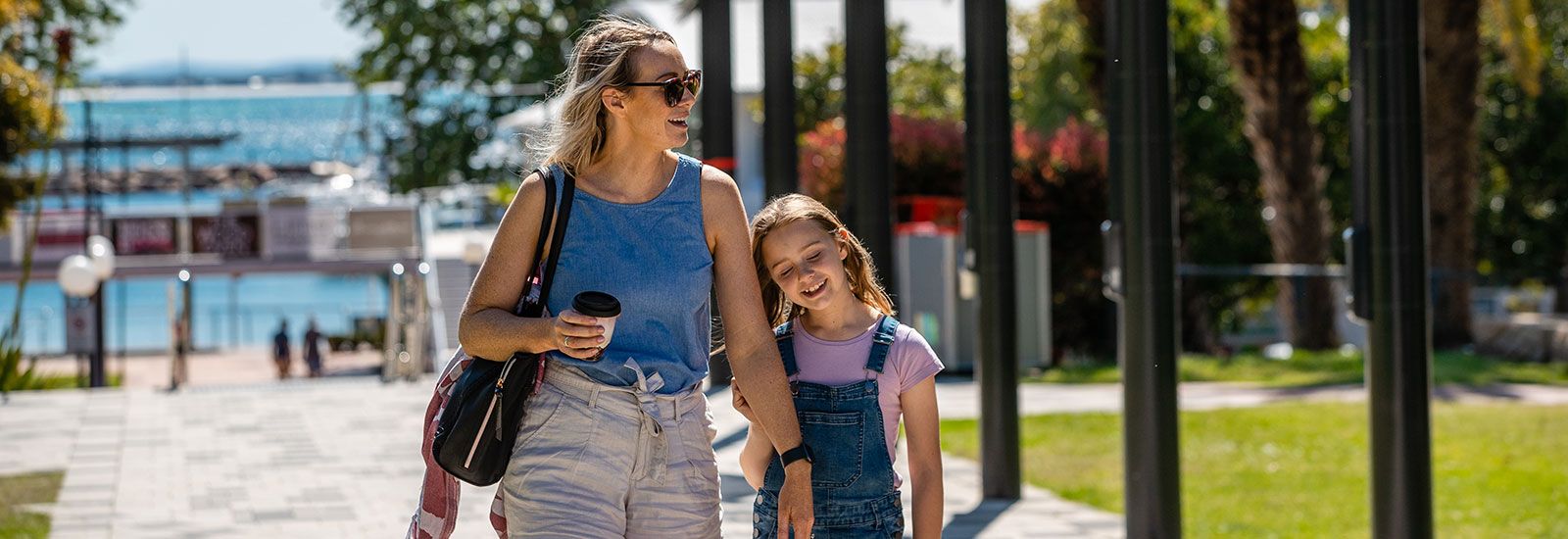 A lady and a girl walking in Nelson Bay banner image