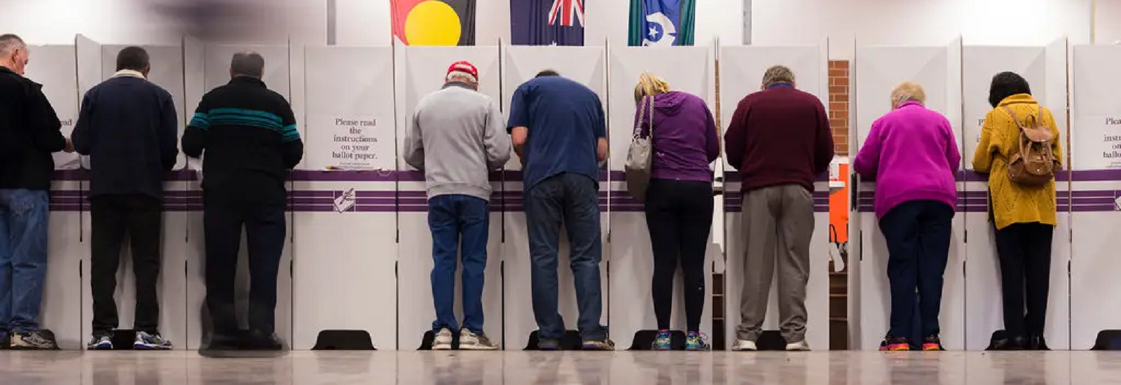 People at polling booth banner image