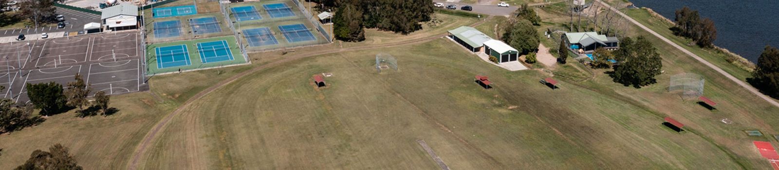 Aerial view of Raymond Terrace sports facilities including soccer fields and netball courts banner image