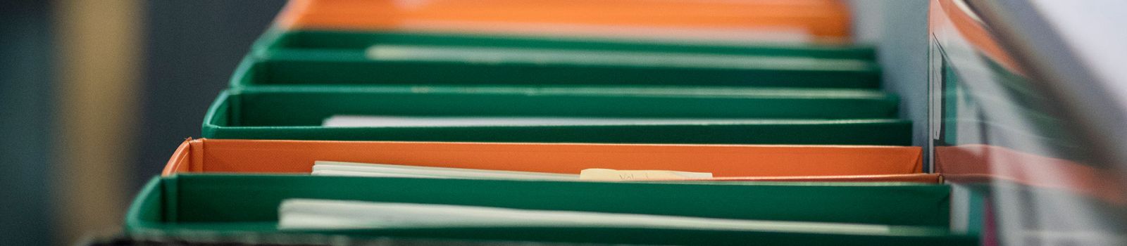 Image of rows of green and orange files  banner image