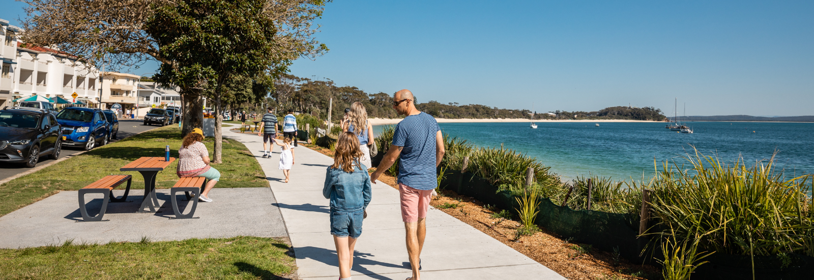 Father and daughter working through Shoal Bay town centre banner image