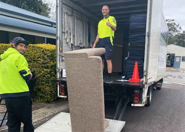 Delivery drivers moving furniture
