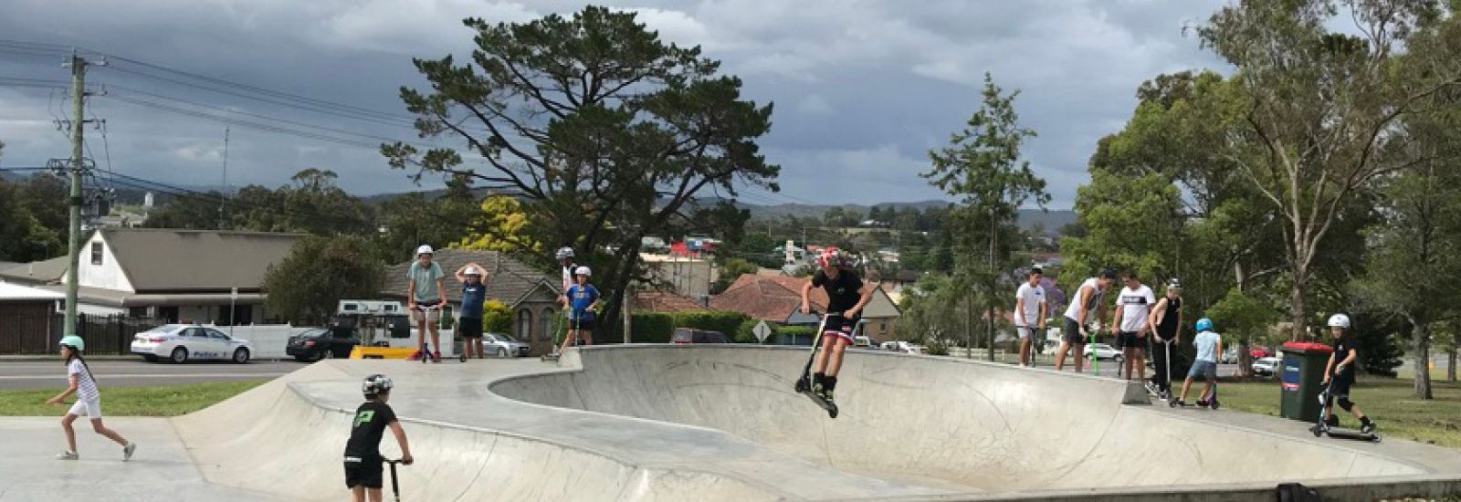 youth skating in the boomerang park skate bowl banner image