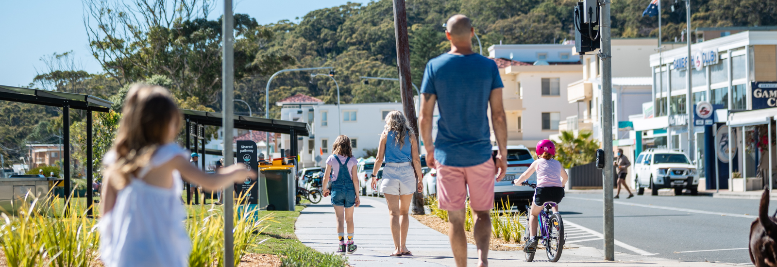 Young family walking along Nelson Bay foreshore banner image