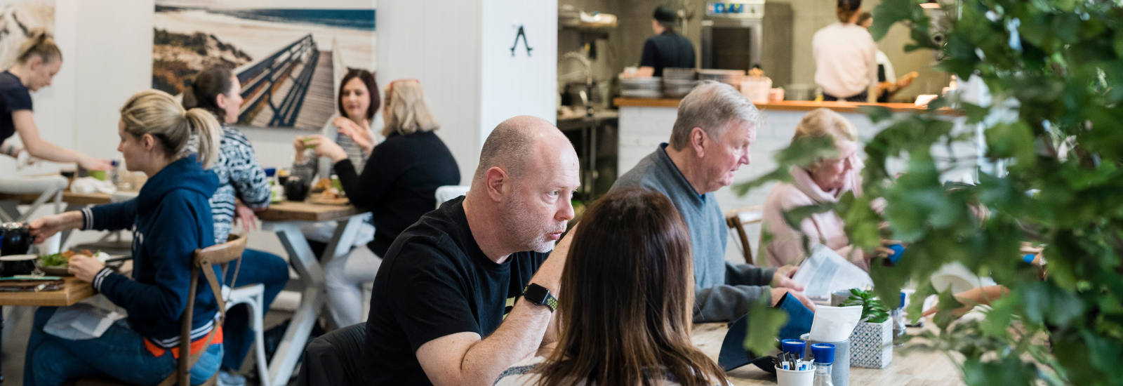 Customers eating at a restaurant in Nelson Bay banner image