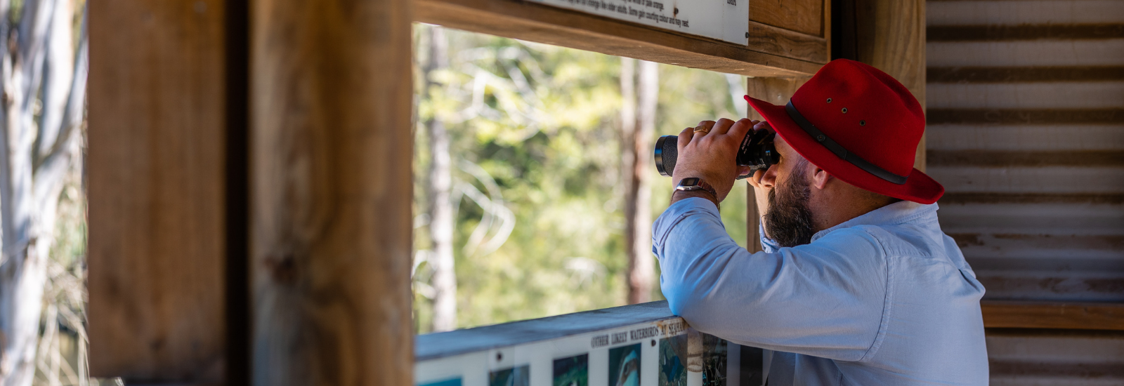 Man using telescope at a national park banner image