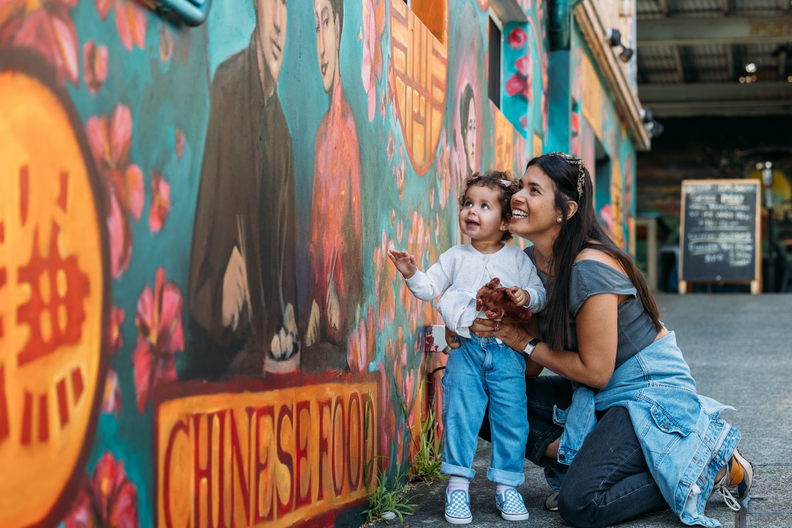 kids admiring art on art walk banner image