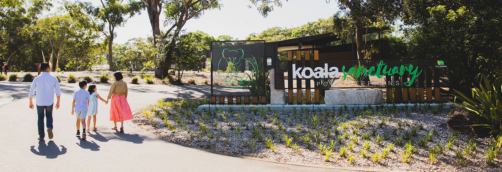 Photo of family entering the Port Stephens Koala Sanctuary banner image