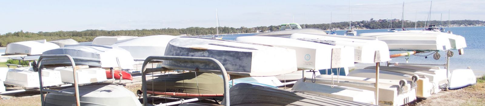 Image of dinghys stored along the foreshore  banner image