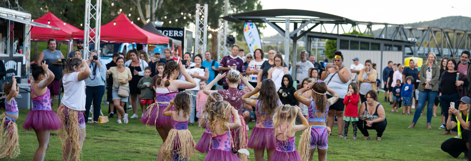 Kids dancing at local community event banner image