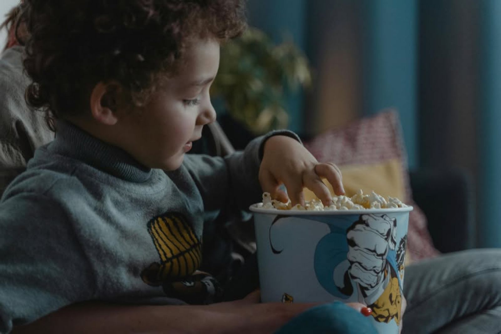 Child eating popcorn banner image
