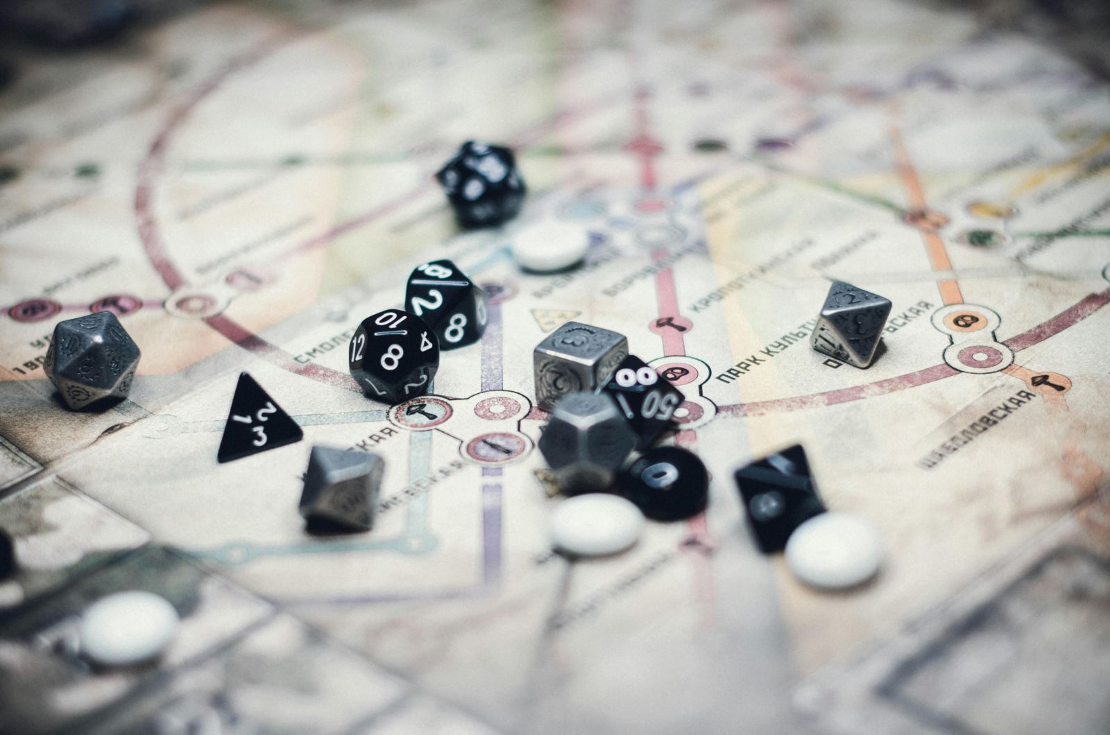 mixed dice on top of a map banner image
